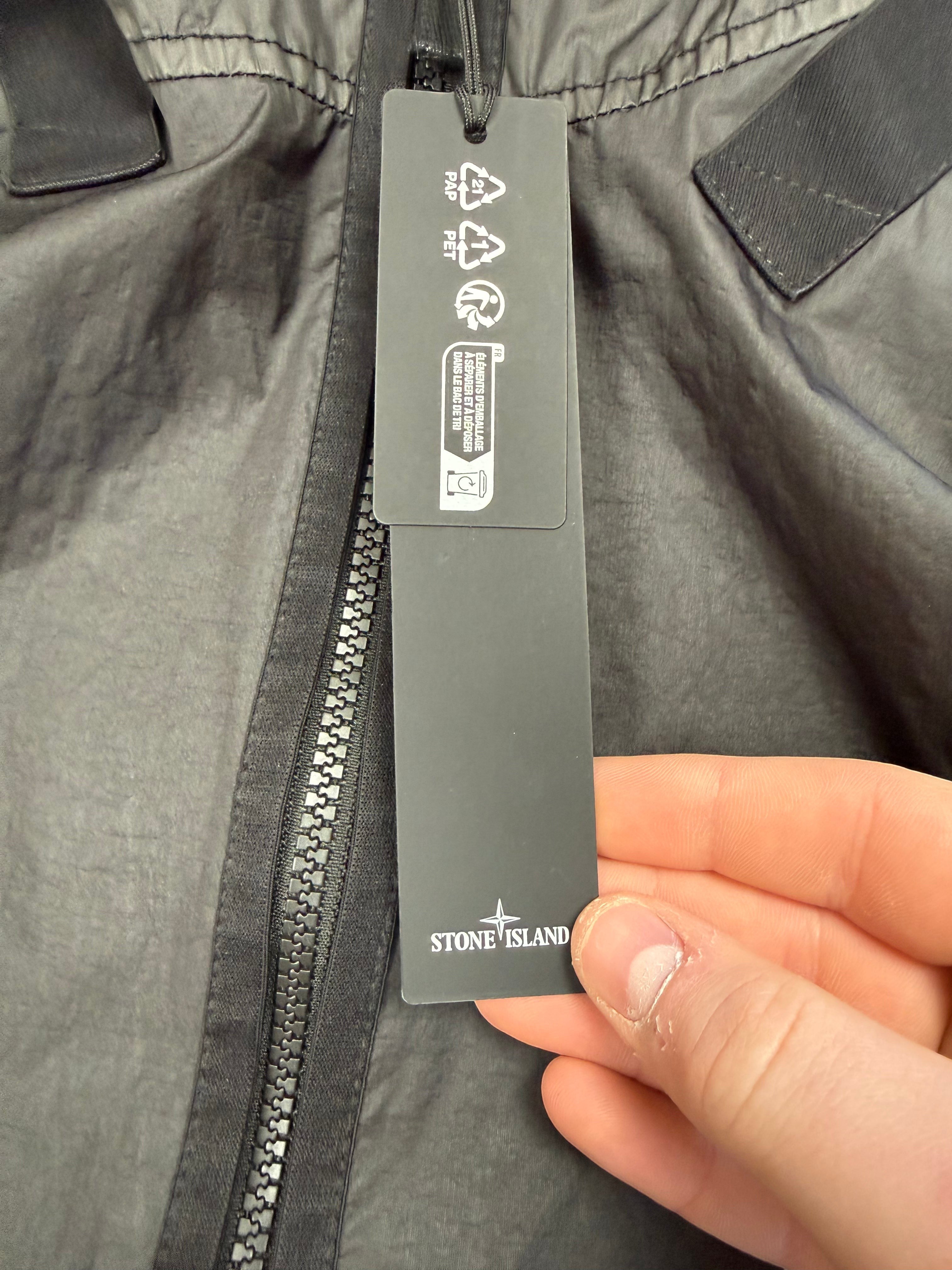 Archive No. 9 Stone Island black Membrana 3L TC waterproof jacket, size M. Features technical fabric and zip closure.