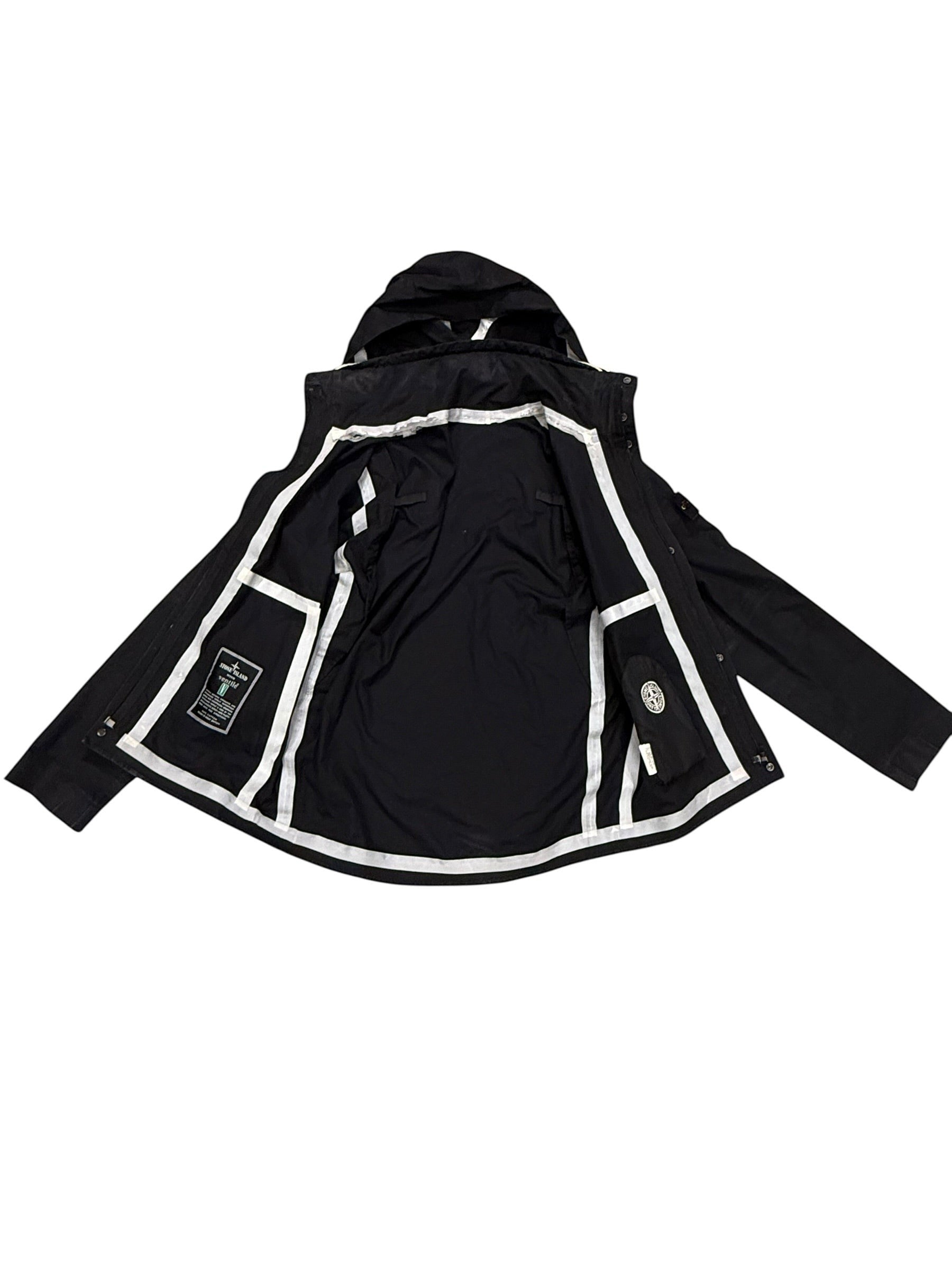 Archive No. 9 black Stone Island Ventile shell jacket with zip-in hood and white piping detail. Size M.