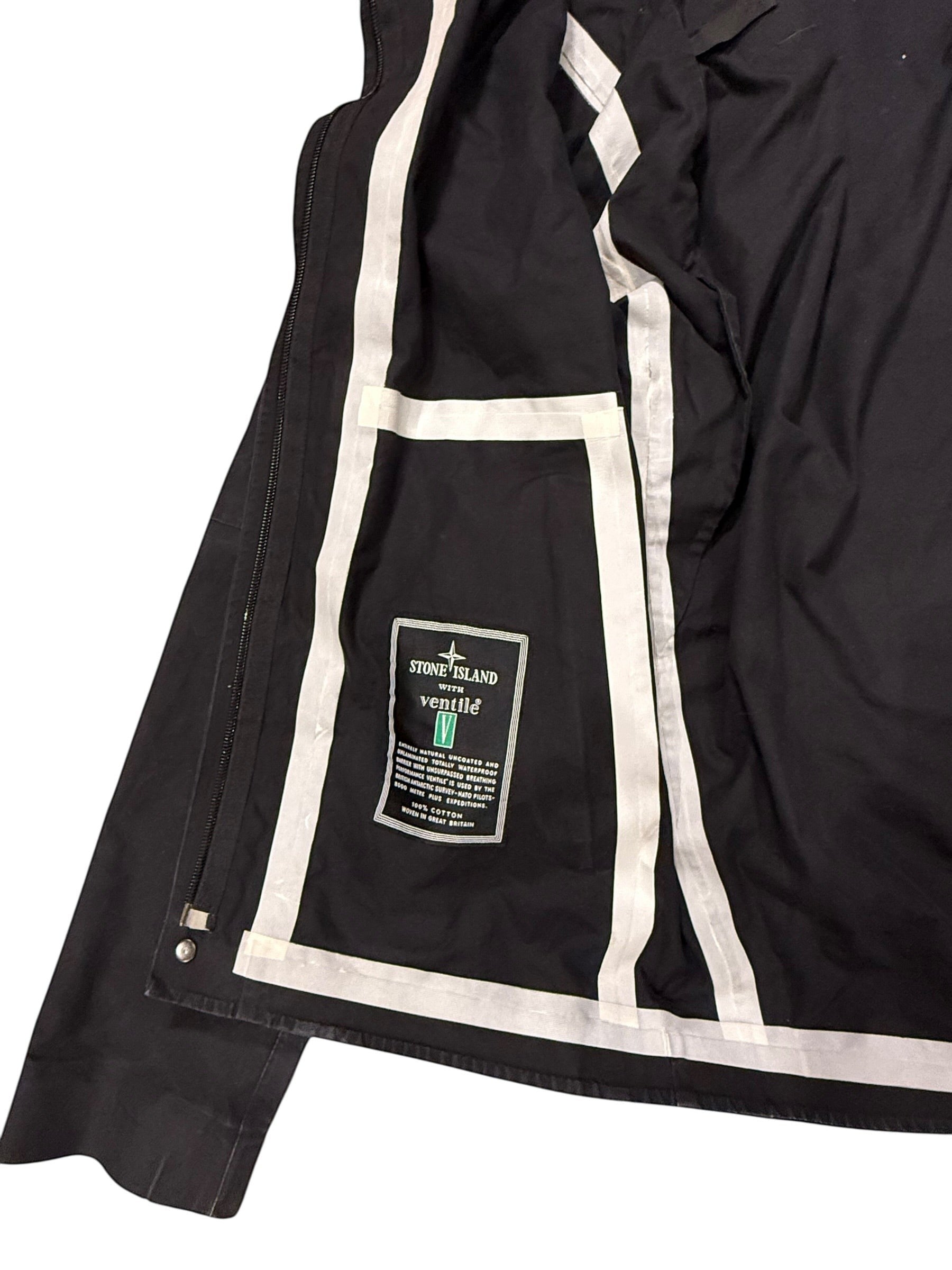 Archive No. 9 Stone Island black Ventile shell jacket with zip-away hood, size M. Features white piping and internal pockets.