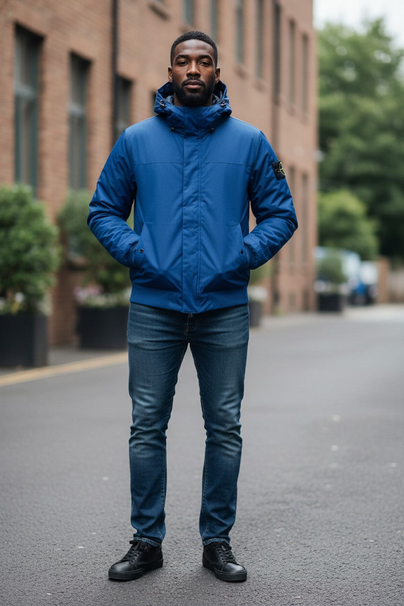 Archive No. 9 Stone Island blue hooded puffer jacket XL, weatherproof, down-filled for warmth.