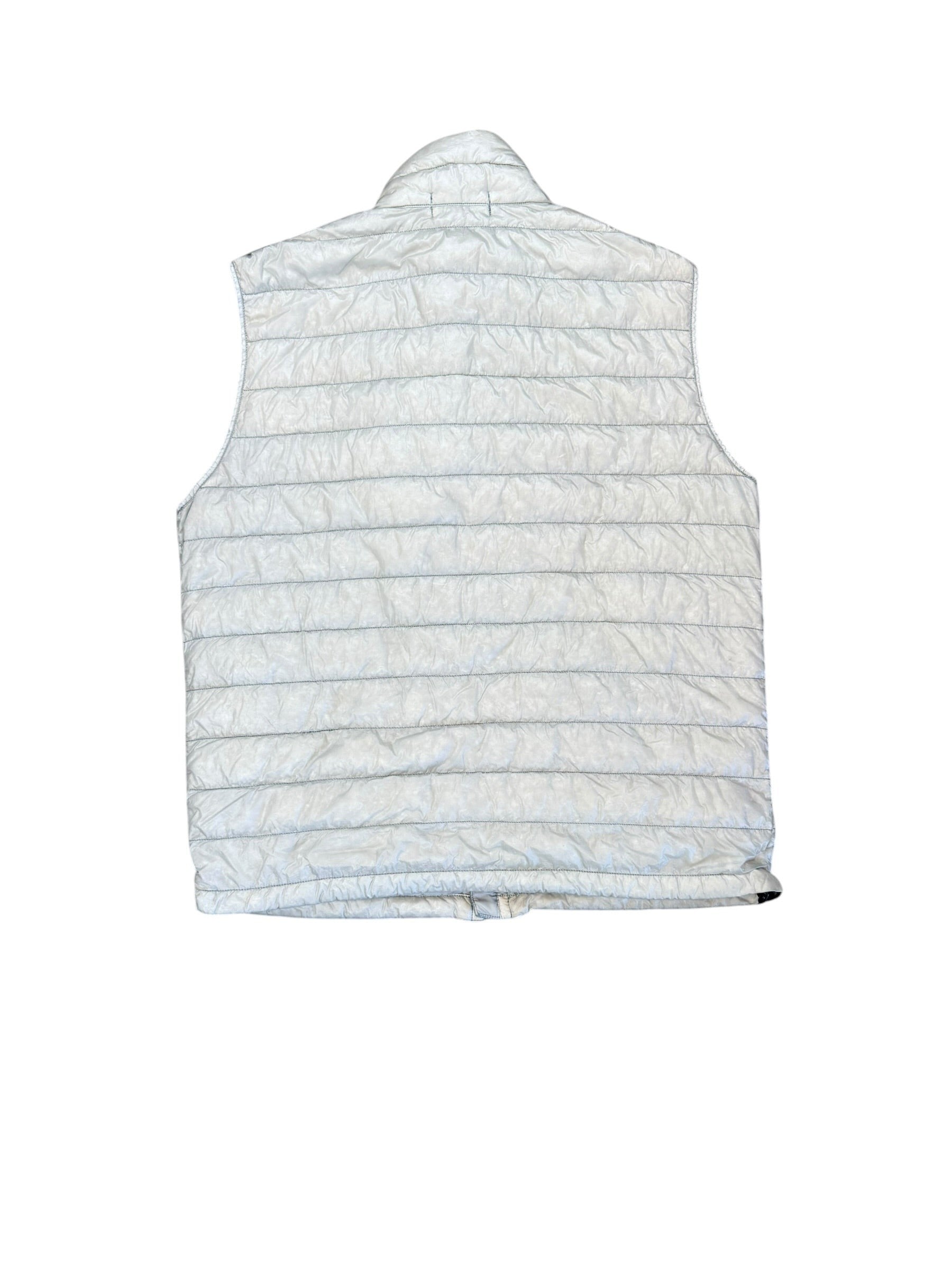Archive No. 9 Stone Island grey garment-dyed puffer body warmer with white accents, size L. Features a zip closure and badge option.