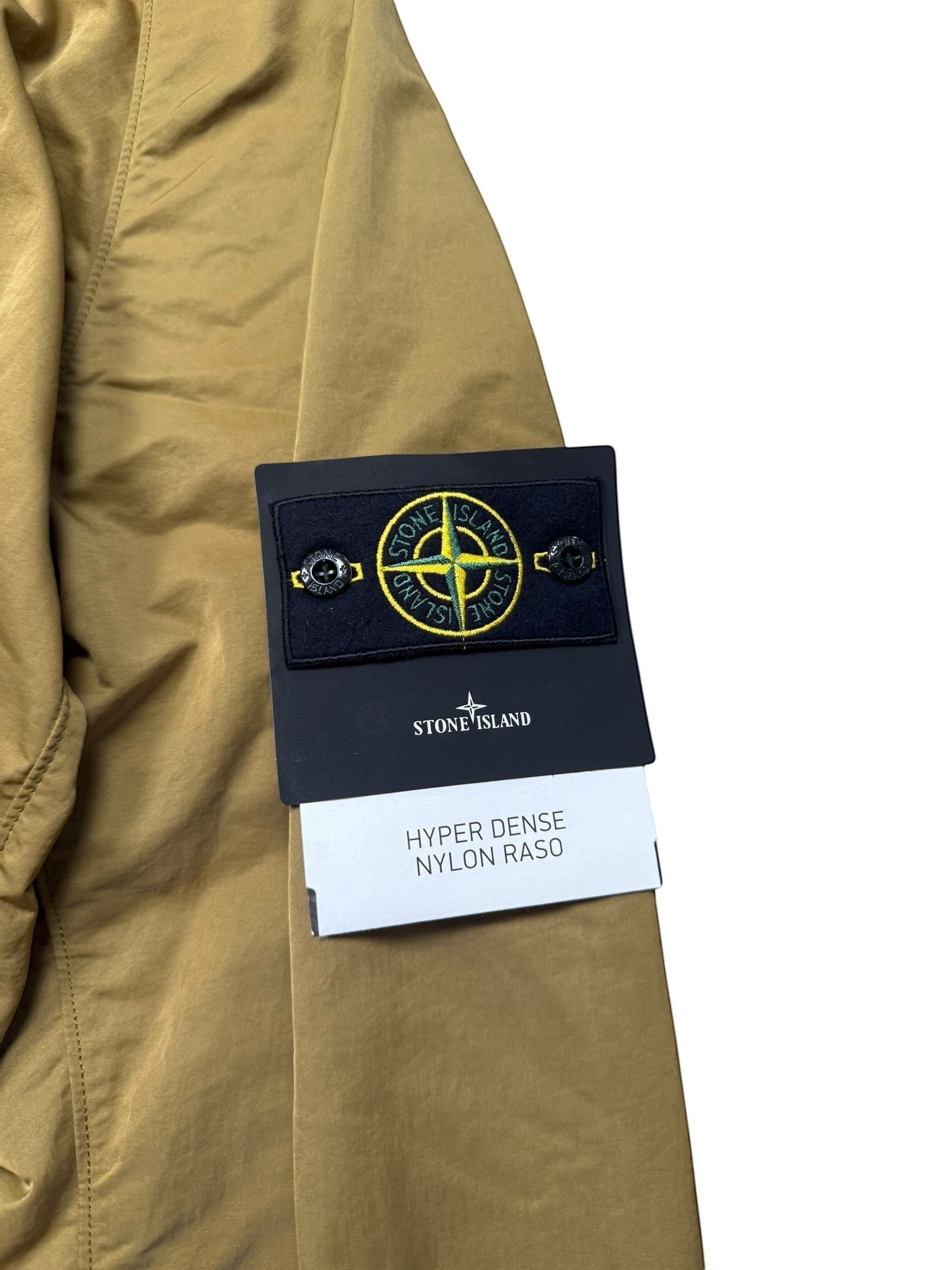 Archive No. 9 khaki Stone Island Hyper Dense Nylon Raso windbreaker jacket with signature compass badge. Lightweight, breathable, waterproof, and wind-resistant.