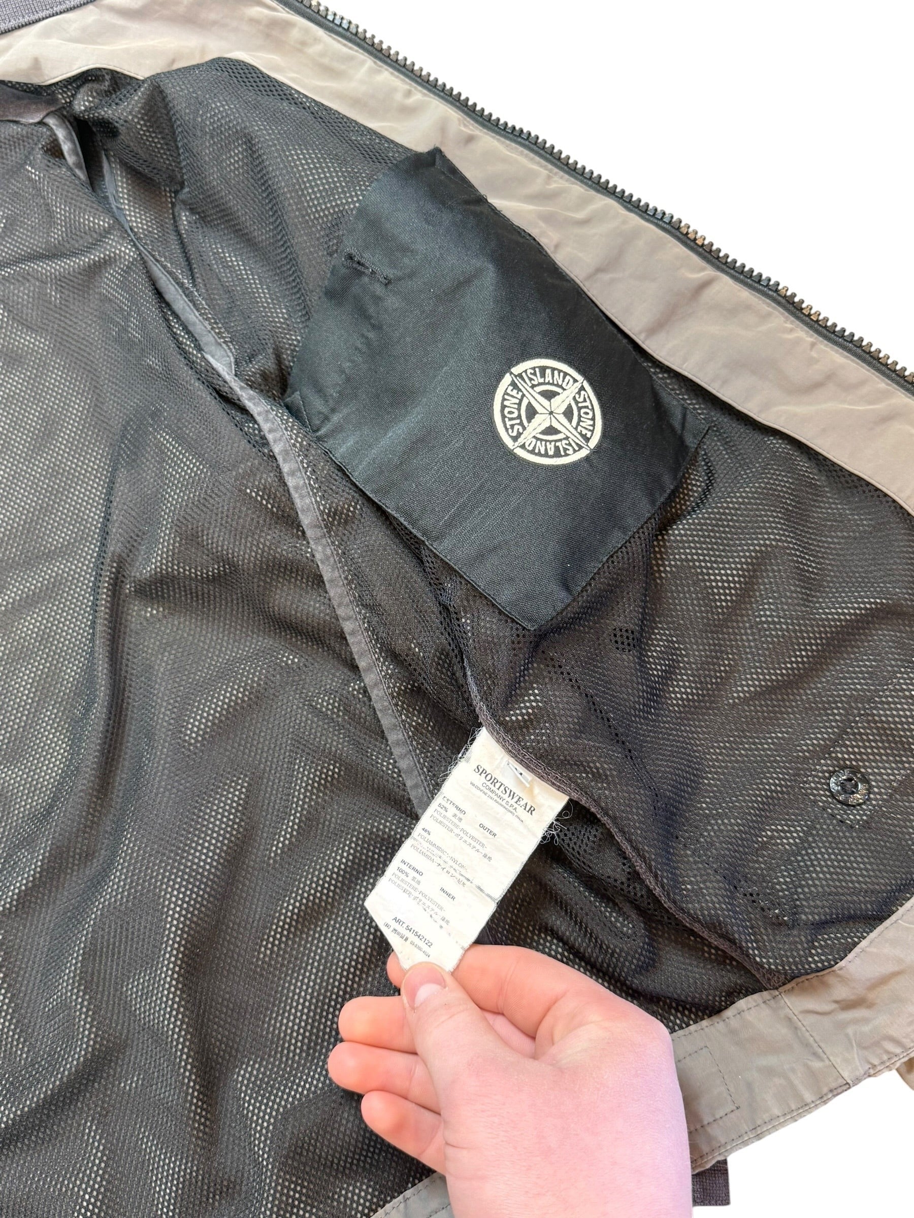 Archive No. 9 Stone Island vintage khaki windbreaker jacket with mesh lining and Stone Island badge detail.
