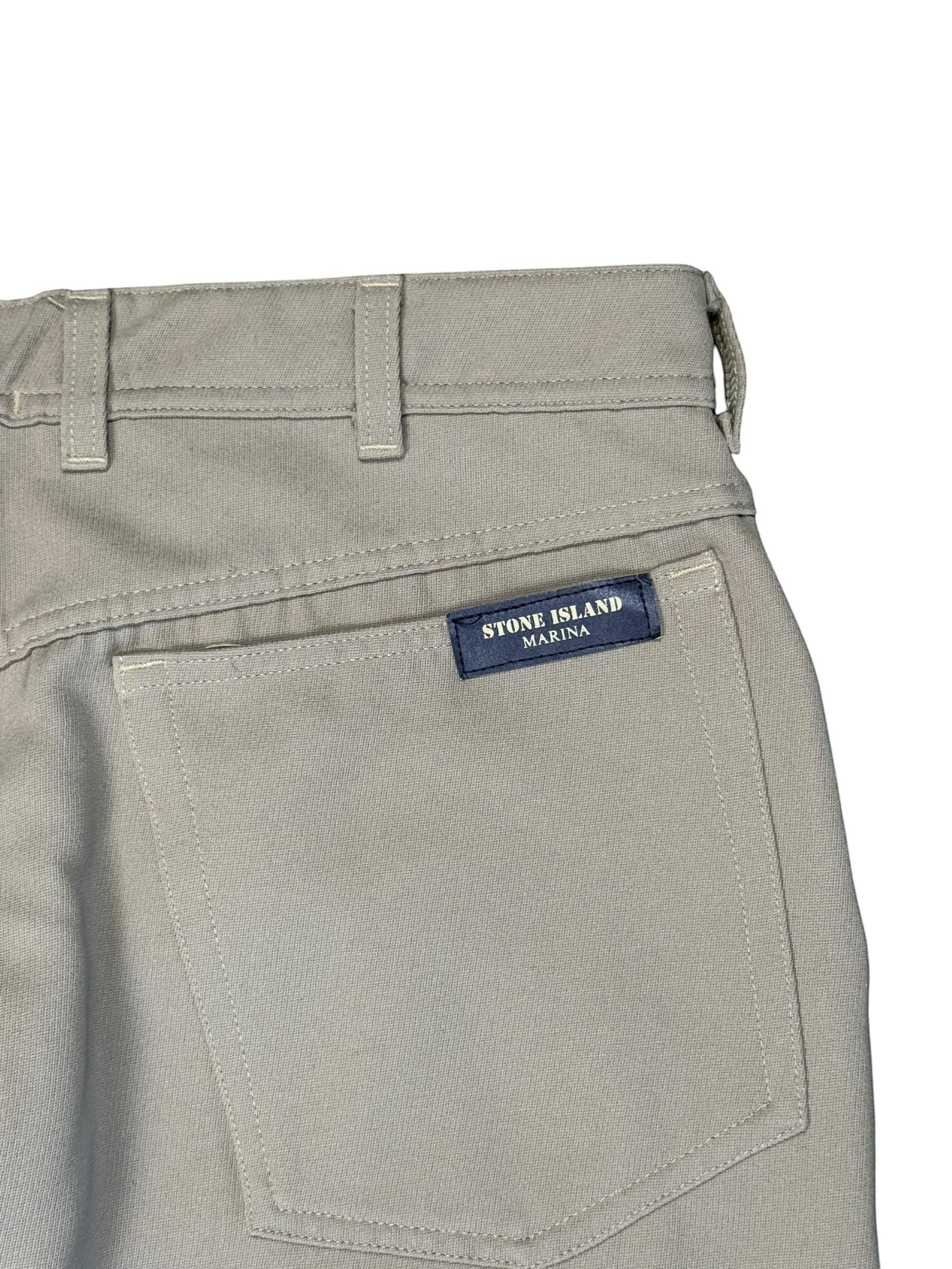 Archive No. 9 Stone Island Marina beige trousers, size W36, featuring a leather patch on the back pocket.