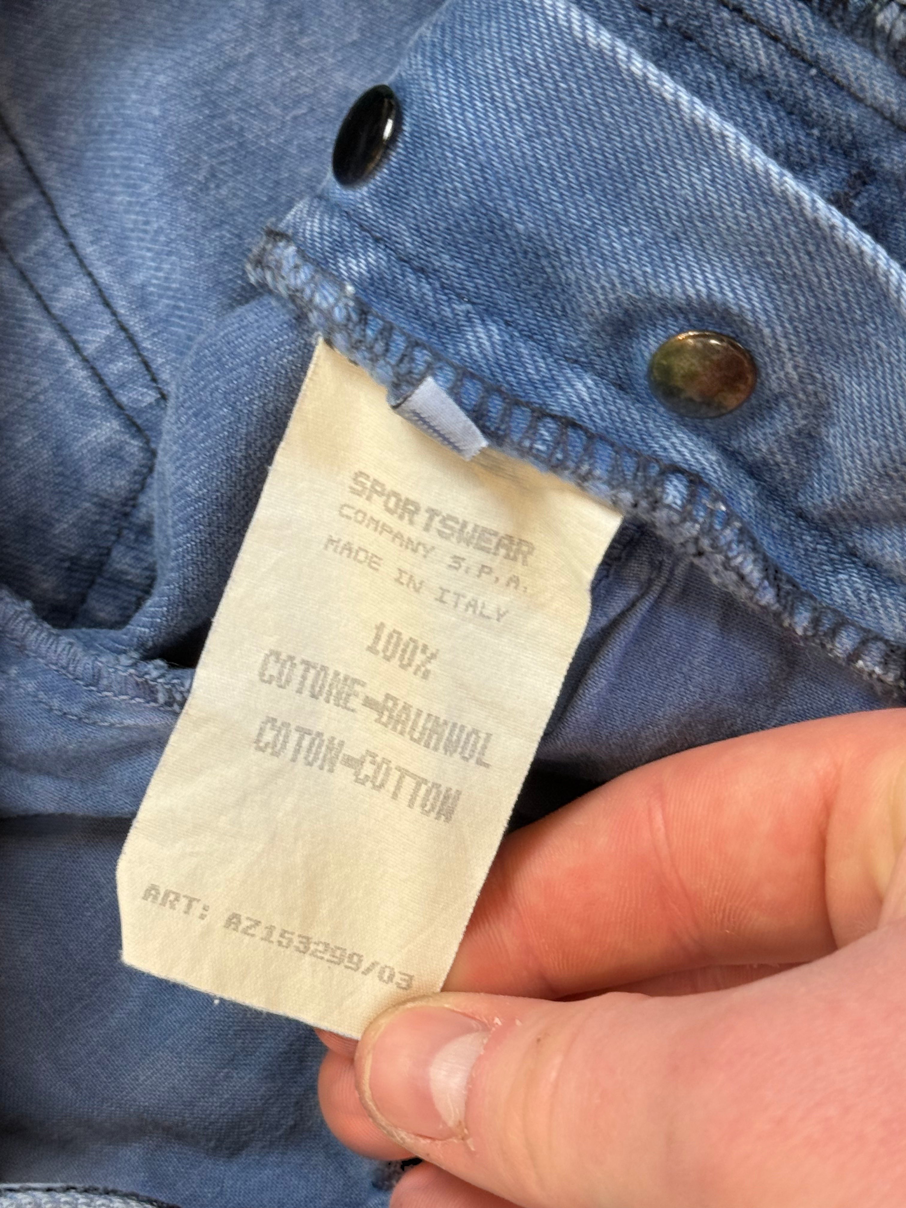 Archive No. 9 vintage Stone Island navy blue cotton denim shorts, size L, with green edge badge detail.