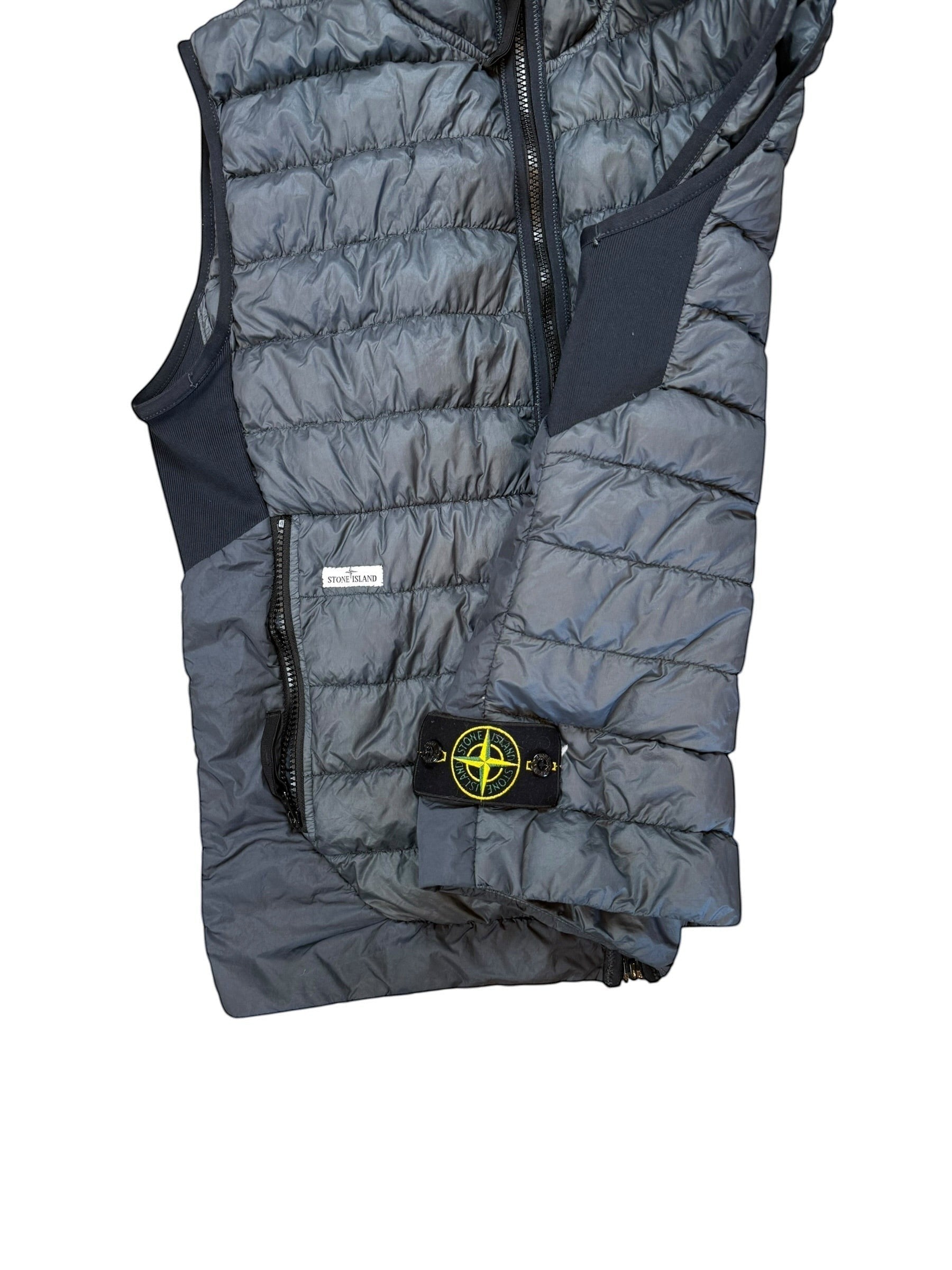 Archive No. 9 Stone Island navy micro yarn down filled body warmer, size L. Lightweight insulation with signature compass badge.