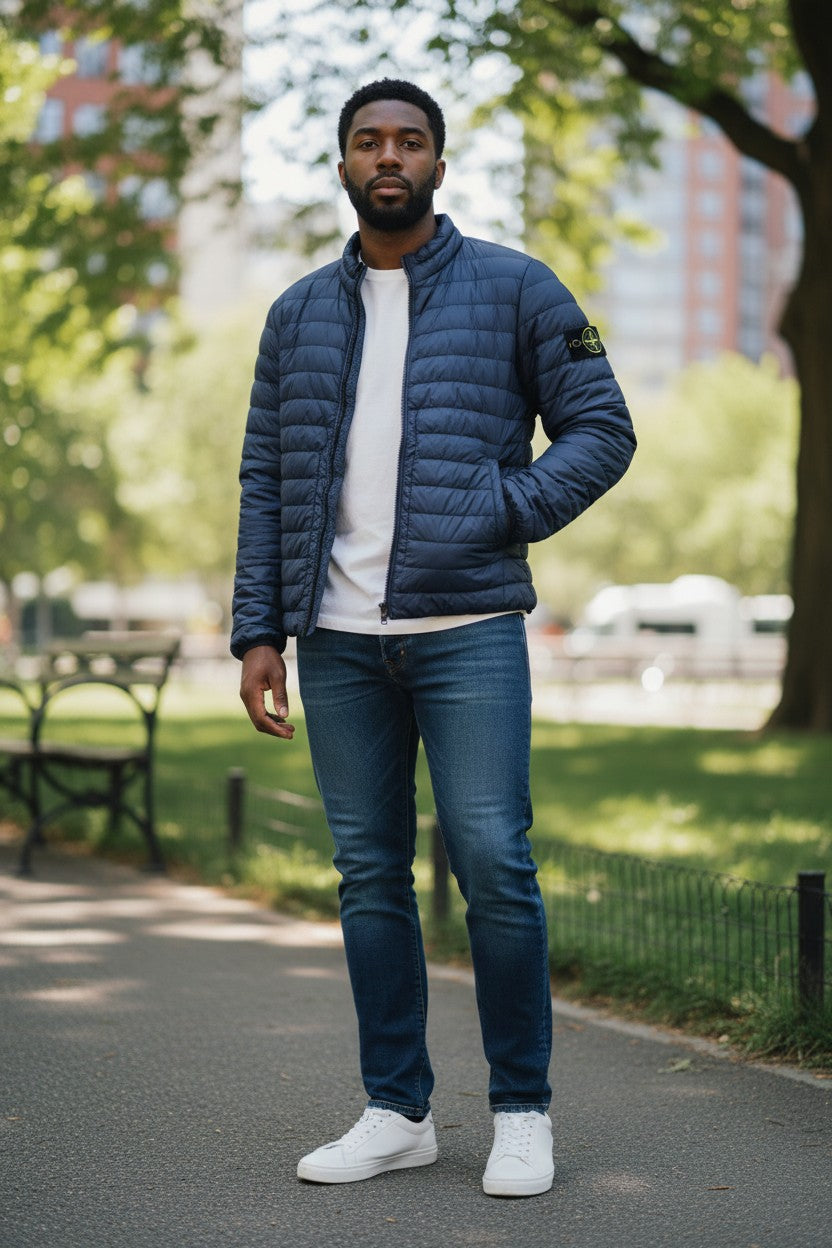 Archive No. 9 navy blue Stone Island puffer jacket, size XL, down-filled, wind and water-resistant with signature compass badge.