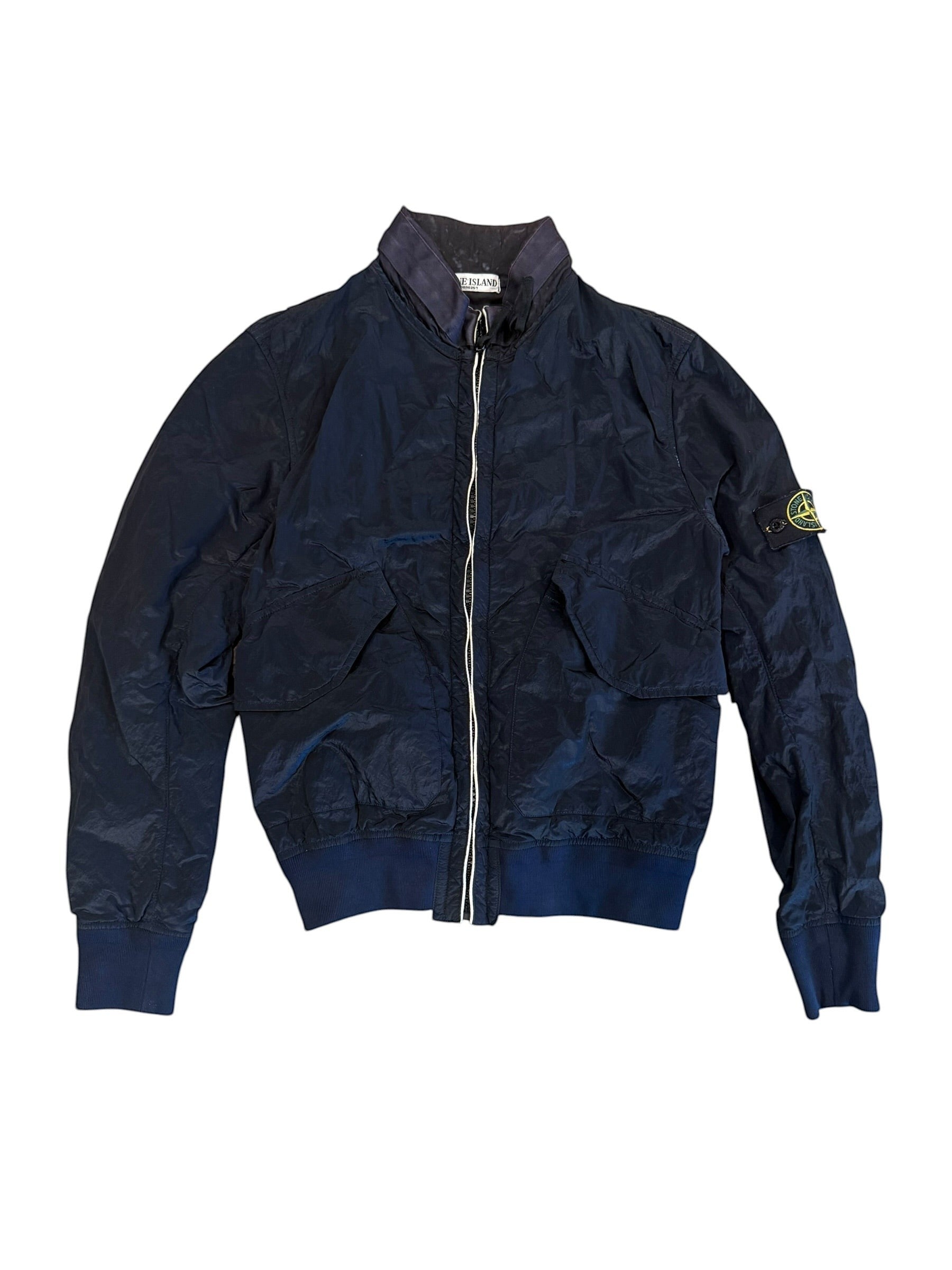 Archive No. 9 vintage navy blue Stone Island bomber jacket with zip closure and iconic compass badge on sleeve.