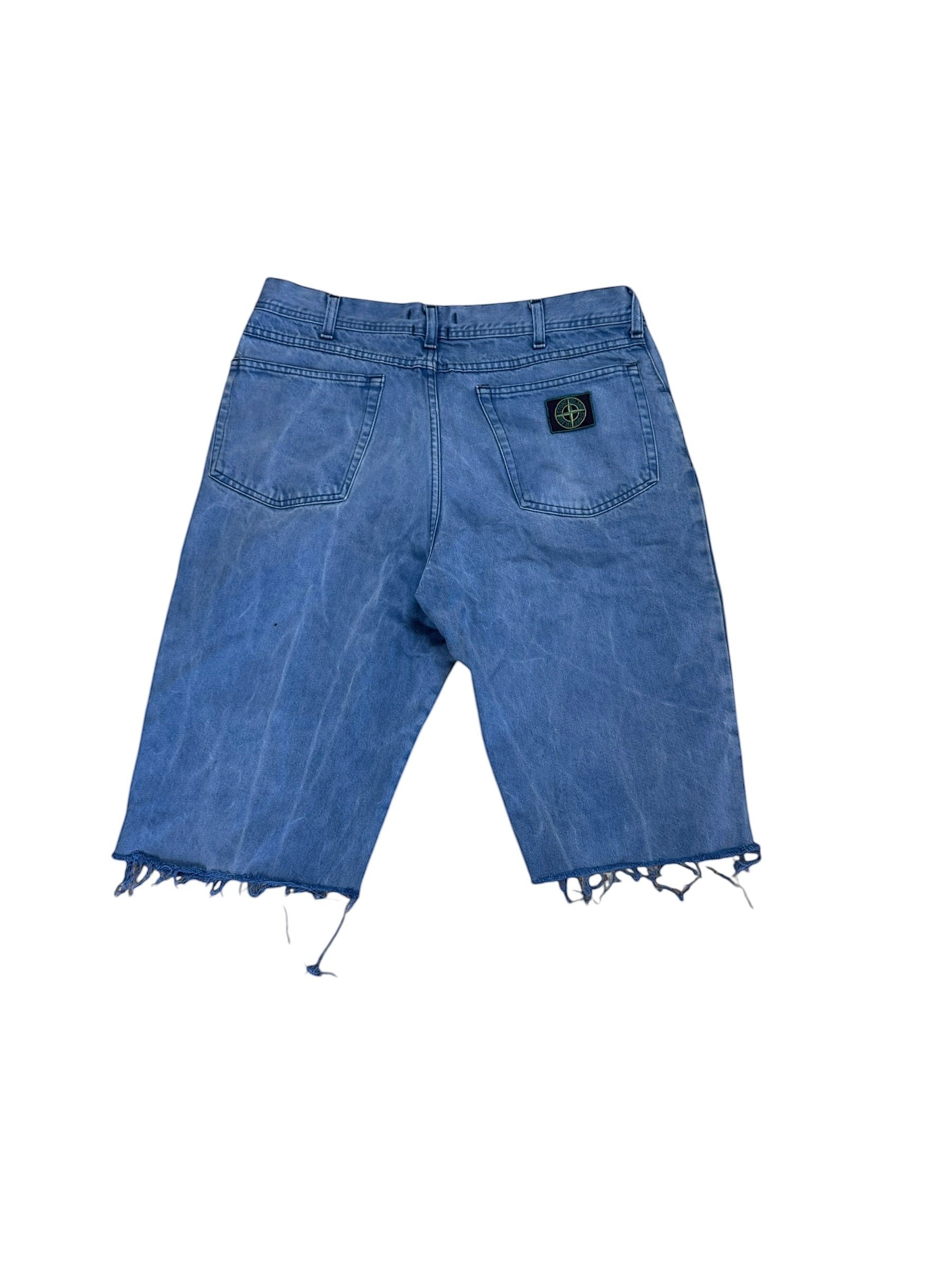 Archive No. 9 vintage Stone Island navy denim shorts, size L, with green edge badge and raw hem.