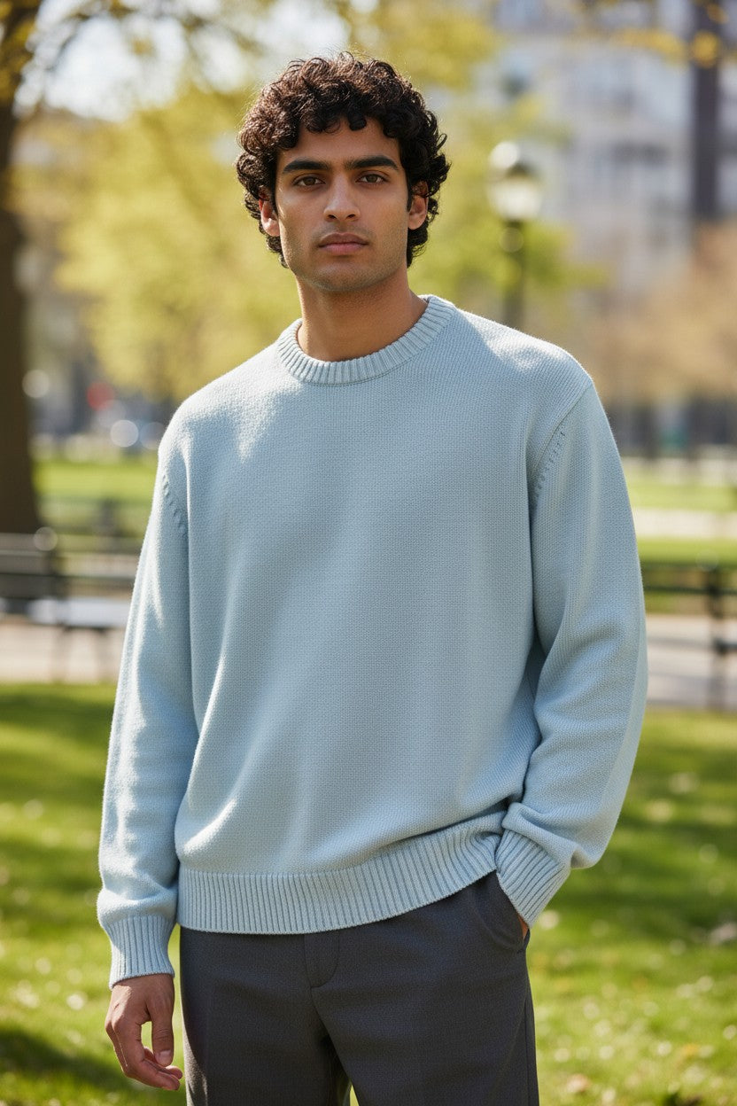 Archive No. 9 Valentino Knit Jumper in teal/blue, size Medium. Features a crew neck and ribbed cuffs and hem.