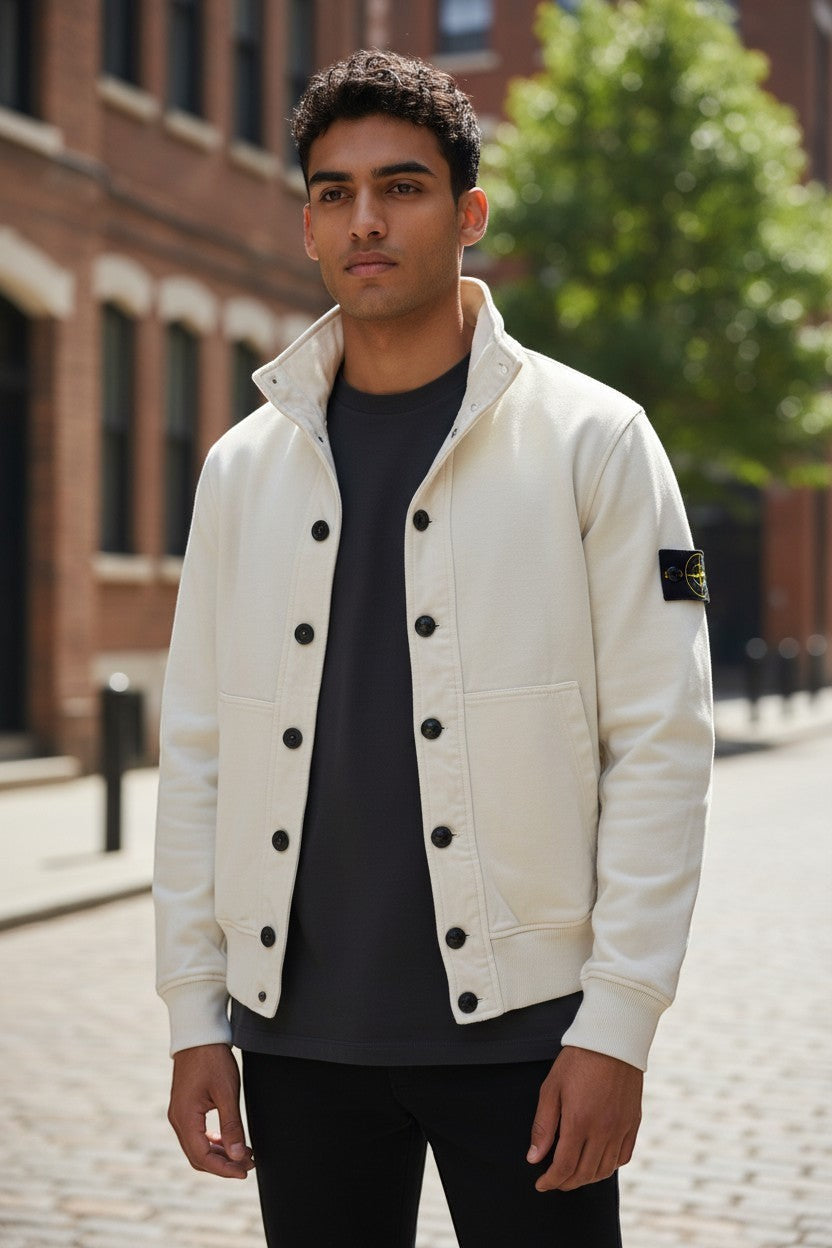 Archive No. 9 white Stone Island cotton jacket with button-up front and signature badge on sleeve.